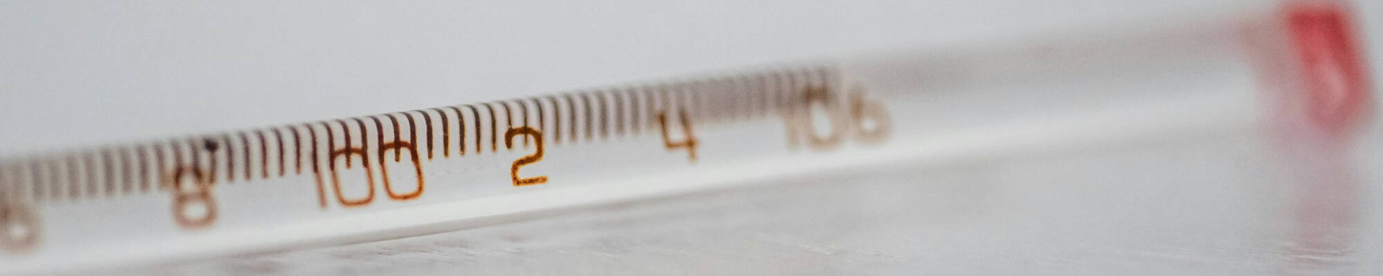 Closeup of an analog thermometer